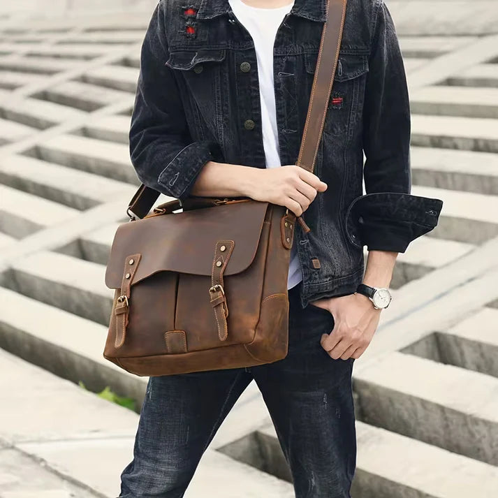 Vintage Genuine Leather Men's Briefcase, featuring an adjustable shoulder strap, gold-tone hardware, and a zippered closure