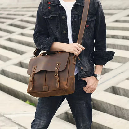Vintage Genuine Leather Men's Briefcase, featuring an adjustable shoulder strap, gold-tone hardware, and a zippered closure
