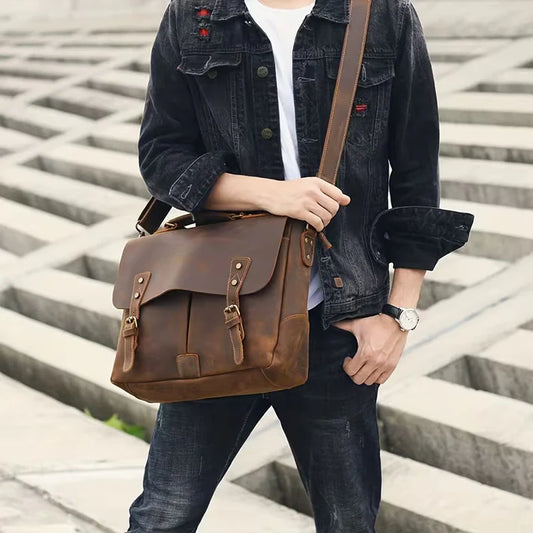 Vintage Genuine Leather Men's Briefcase, featuring an adjustable shoulder strap, gold-tone hardware, and a zippered closure